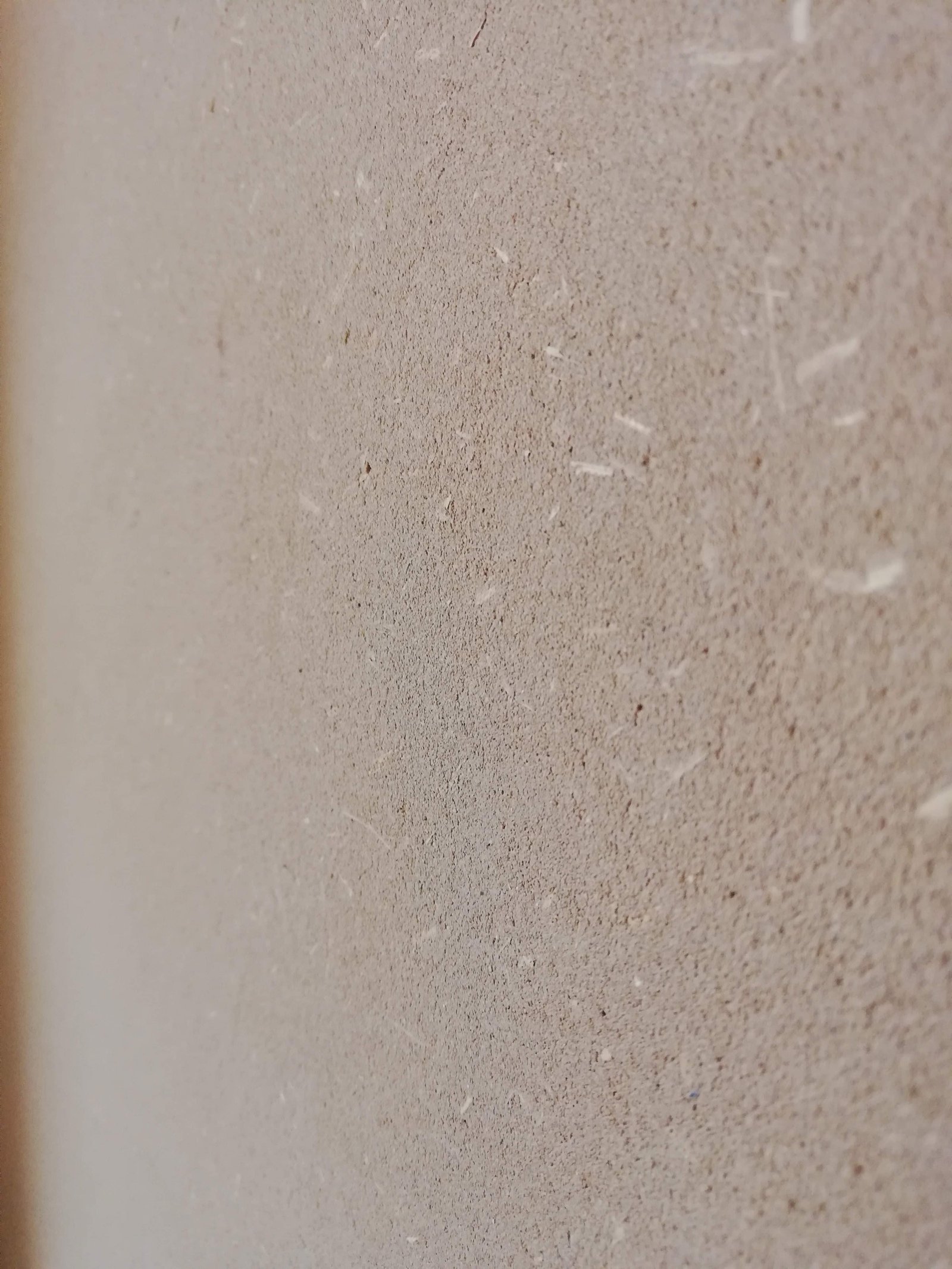 Marmorino-Putzoberfläche, cremefarbener Kalkputz mit feiner Sandkörnung, Nahaufnahme